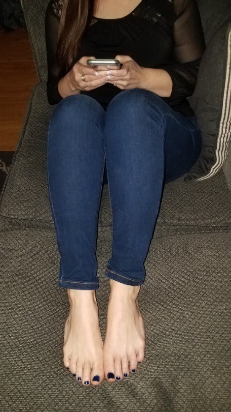 My Pretty Wife Sitting On The Couch With Her Phone Fee